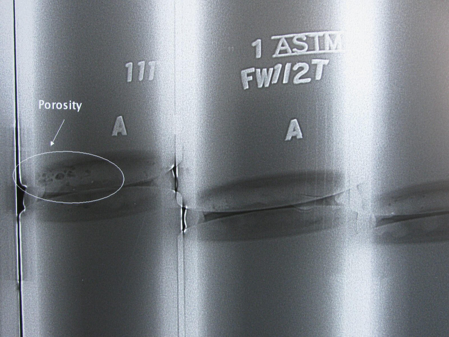 Digitized weld radiograph showing porosity indication